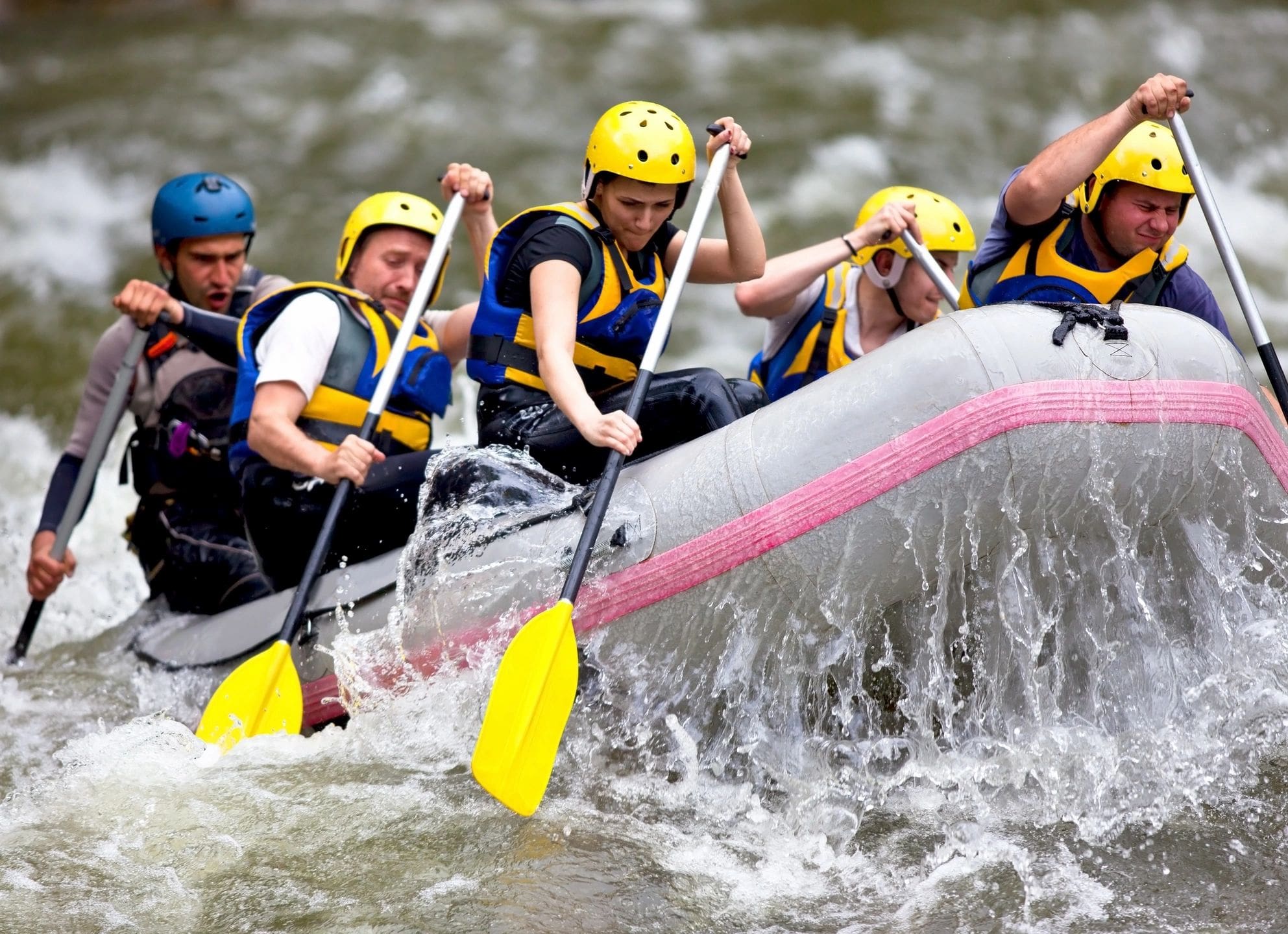 A group of people in boats on water.